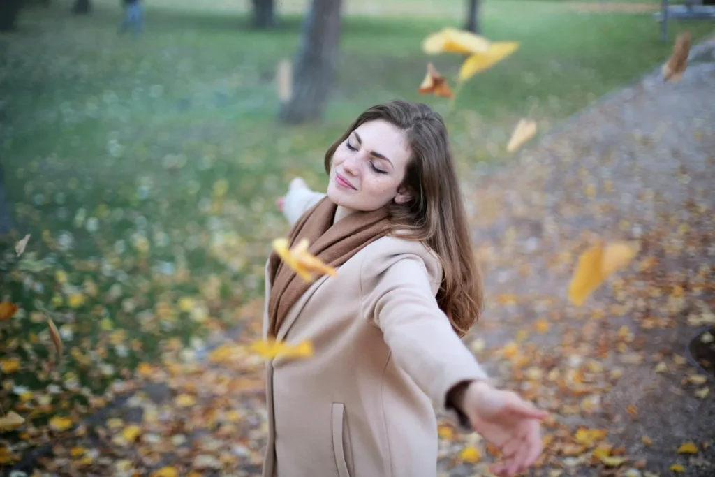 Woman smiling outdoors representing women’s health exam clinic in Whitby